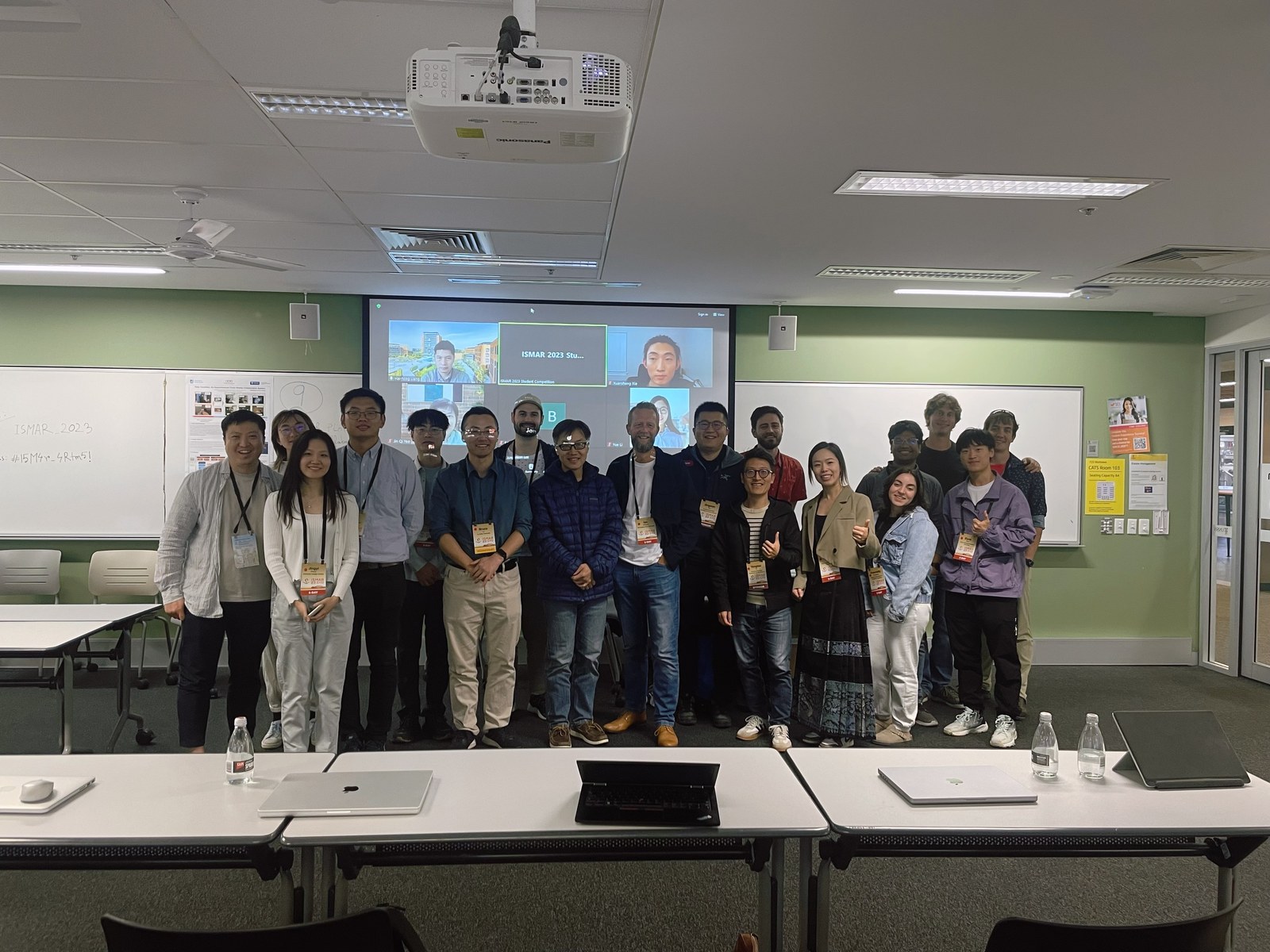 A group photograph at an ISMAR 2023 session in Sydney.